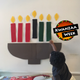 The author’s son, Garvey, celebrating Kwanzaa 2017 (courtesy of Moji Alawode-El); photo illustration by GMG/The Root